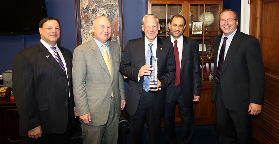 Rep. Steve Israel (D-NY) (center) accepts CAI’s 2015 Hero of Associations award from (left to right) 2015 CAI President David I.